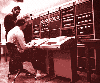 \begin{pic}{1969rt.ps}{1969rt}{Dennis \& Ken on the PDP-7}
\end{pic}